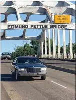  ?? PHOTOS BY SUE BENHAM to Bakersfiel­d.com. go ?? ABOVE: Cars drive over the Edmund Pettus Bridge in Selma, Ala. BELOW: Footsteps leading to the state house in Montgomery, Ala., honoring the marchers who marched from Selma to Montgomery. To see more photos,