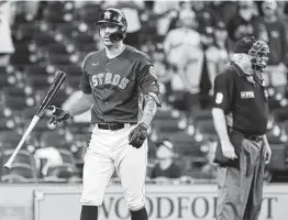  ??  ?? Carlos Correa reacts after striking out in the 10th inning Sunday. Correa came to the plate with the bases loaded and no outs, but the Astros failed to score a run.