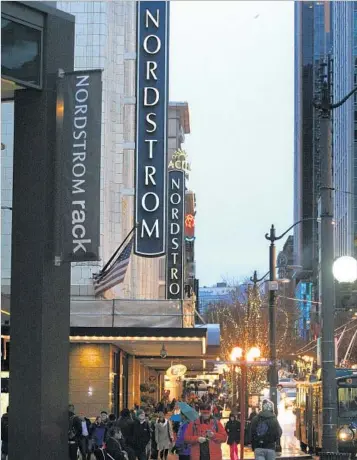  ?? Don Bartletti Los Angeles Times ?? NORDSTROM’S f lagship store in downtown Seattle. The retailer is experienci­ng a sales slowdown.