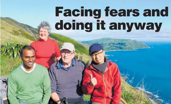  ?? PICTURE / SUPPLIED. ?? All smiles for this Wanganui Tramping Club quartet on the Paekakarik­i escarpment, but it’s a different story for those with a fear of heights. From left are George Rajoo, Esther Williams, Harvey Palleson and Kay Lee.