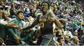  ?? THOMAS BOYD — THE ASSOCIATED PRESS ?? Baylor forward Jonathan Tchamwa Tchatchoua (23) celebrates in the second half against Oregon during an NCAA college basketball game in Eugene, Ore., Saturday.