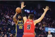  ?? EZRA SHAW — GETTY IMAGES ?? The Warriors’ Andrew Wiggins (22) shoots over the
Bulls’ Nikola Vucevic (9) at Chase Center on Friday in San Francisco.