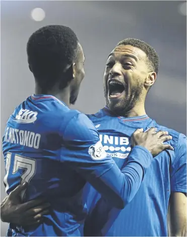  ?? ?? Rangers striker Cyriel Dessers, right, celebrates with Rabbi Matondo following his opening goal