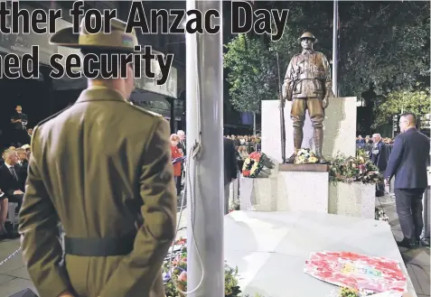  ??  ?? An Australian soldier stands at attention during the Anzac Day dawn service in Sydney. — AFP photo