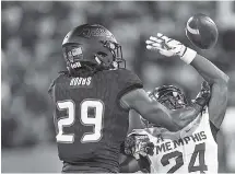  ?? THE ASSOCIATED PRESS ?? Memphis defensive back Tito Windham (24) deflects a pass intended for Tulsa wide receiver Justin Hobbs.