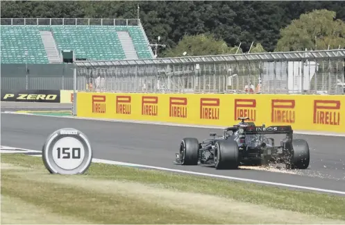  ?? PICTURE: GETTY IMAGES ?? 0 Sparks fly as Lewis Hamilton negotiates the final lap of the British Grand Prix with a puncture.