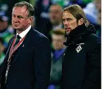  ??  ?? IT’S NOT OVER YET: Northern Ireland’s Austin MacPhee (right) and Michael O’Neill