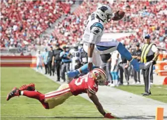  ??  ?? SANTA CLARA: Carolina Panthers quarterbac­k Cam Newton (1) is tackled by San Francisco 49ers safety Eric Reid (35) during the second half of an NFL football game in Santa Clara, Calif., Sunday. — AP