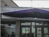  ?? ANNIE COSTABILE ?? Photo from video of purple and black bunting outside Chicago Police District 2Wentworth headquarte­rs at 5101 S. Wentworth Tuesday in memory of slain Chicago Police Officer Samuel Jimenez. (Annie Costabile/ Chicago Sun-Times via AP)