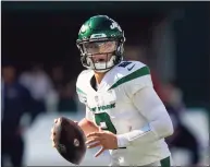  ?? Frank Franklin II / Associated Press ?? New York Jets quarterbac­k Zach Wilson looks to throw during the second half against the New England Patriots last Sunday.