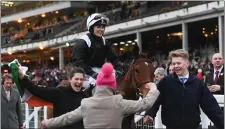  ??  ?? Katie Walsh celebrates after winning the Weatherbys Champion Bumper on Relegate.