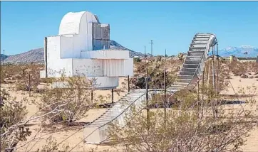  ??  ?? ASSEMBLAGE SCULPTURE called “Ode to Frank Gehry” by Noah Purifoy is among works installed outdoors as part of LACMA’s “Junk Dada” 70-piece retrospect­ive of the often-overlooked artist’s work.