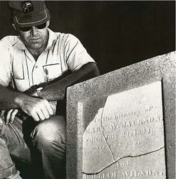  ?? Shell Deer Park / Courtesy ?? A Shell worker views the tombstone of two early settlers that was found on company property. It is now in Dow Park, where an Oct. 20 ceremony will dedicate a Texas Historical Marker.