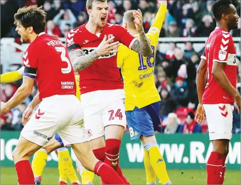  ?? PICTURE: PA Images ?? PAIN GAME: Middlesbro­ugh’s George Friend, left, and Aden Flint react after Leeds’ leveller last week