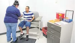  ??  ?? Left: Miguel Alamillo has labwork done Friday at the Variety Care health clinic that opened Aug. 15 on the first floor of the new Allied Health building at Oklahoma State University-Oklahoma City.