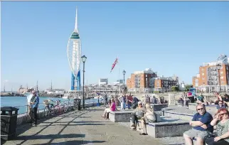  ?? SALTY AND MODERN PORTSMOUTH ?? South of the Spinnaker Tower, the Millennium Promenade hugs the water and leads to Portsmouth’s quaint historic district. Candy-floss-on-the-beach fun offers a touristy feel.