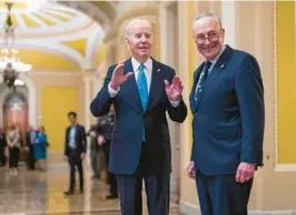  ?? J. SCOTT APPLEWHITE/AP ?? President Joe Biden visits the Capitol and chats with Sen. Chuck Schumer and the media Thursday.