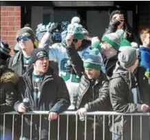  ?? GENE WALSH — DIGITAL FIRST MEDIA ?? Eagles fans enjoy the moment before the start of the Victory Parade along Broad in downtown Philadelph­ia.