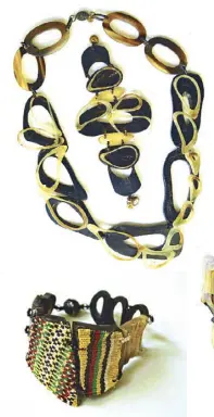  ??  ?? Carabao horn bracelet with indigenous material. Black and white doily design necklace and bracelet set in goat horn.