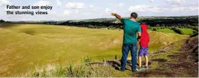  ??  ?? Father and son enjoy the stunning views