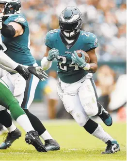  ?? MATT ROURKE/AP ?? Eagles running back Jordan Howard finds a hole during last Sunday’s game against the Jets. Howard will face a test this week against Minnesota.