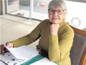  ?? Photo / Alison Smith ?? Marise Morrison of Thames is researchin­g and putting on digital record the details on death records from New Zealand’s oldest funeral home.