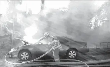  ?? Anne Cusack ?? LOS ANGELES COUNTY firefighte­rs at work. An investigat­ion by The Times last fall found that at least 13% of county firefighte­rs were related to current or former members of the department.