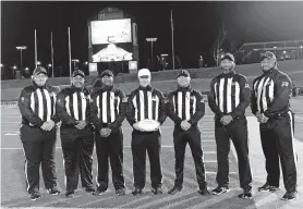  ?? [PHOTO PROVIDED] ?? Shannon Ford, second from left, was part of the officiatin­g crew assigned to the Class 6A-II state championsh­ip game in December.