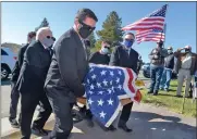  ?? Dan Watson/The Signal ?? Family members carry the flag-draped casket of U.S. Army Vietnam combat veteran William “Bill” Reynolds to the Veterans Memorial Wall at Eternal Valley Memorial Park and Mortuary in Newhall on Saturday.