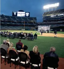  ?? AP ?? Guests at the Oakland-Alameda County Coliseum attend a memorial service for Raiders coach John Madden on Monday.