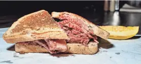  ?? JOVANNY HERNANDEZ / MILWAUKEE JOURNAL SENTINEL ?? The corned beef sandwich at Jake’s Deli is served on seeded rye with a crunchy dill pickle.