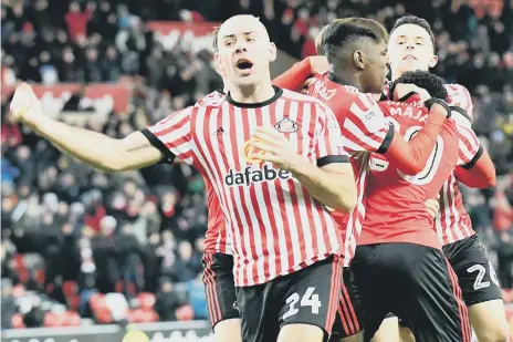  ??  ?? Midfielder Darron Gibson celebrates Josh Maja’s late winner against Fulham at the Stadium of Light. Pictures by Frank Reid.