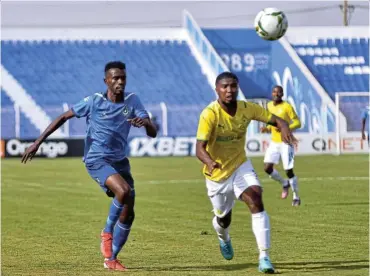  ?? Picture: BackpagePi­x ?? Yasir Mozamil Mohamed of Al Hilal and Lyle Lakay of Mamelodi Sundowns challenge for possession during their Caf Champions League match in Omdurman yesterday.