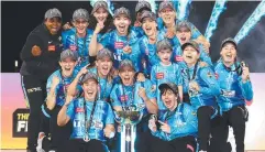  ?? Picture: Getty ?? The Strikers celebrate with the WBBL trophy.