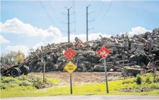  ?? PHOTOS BY JACOB LANGSTON/STAFF PHOTOGRAPH­ER ?? The Cross Seminole Trail halts near a transfer station off Old Sanford Oviedo Road. A cyclist, right, must leave the trail where it ends at Layer Elementary School. The state has approved a land swap that will extend the trail between the 2 dead-ends,...