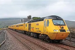  ?? PETER WALKER. ?? Under plans approved by the ORR, Network Rail’s London North Western Region will have the largest pot of funding to spend during the next five years, with almost £9 billion available. On August 27, NR’s New Measuremen­t Train, led by 43062 John Armitt, passes Ribblehead.