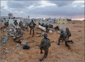  ?? ?? Israeli soldiers take their positions Jan. 4 during a training session simulating urban warfare.