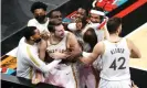  ?? Photograph: Nelson Chenault/USA Today Sports ?? Luka Doncic celebrates with his Mavericks teammates after making the clinching shot against the Grizzlies.