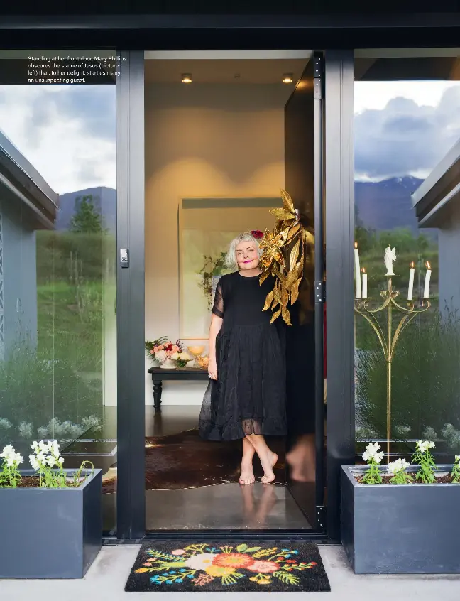  ?? ?? Standing at her front door, Mary Phillips obscures the statue of Jesus (pictured left) that, to her delight, startles many an unsuspecti­ng guest.