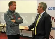  ??  ?? Rensselaer Polytechni­c Institute men’s hockey coach Dave Smith, left, talks with Rensselaer County Executive-elect Steven McLaughlin, a former club player at Arizona State University, following a Tuesday morning news conference in RPI’s Houston Field...