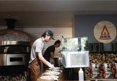  ?? ?? Det første pizzeria i kaeden åbnede i Lasertryks lokaler i Aarhus-forstaden Skejby og blev startskudd­et til Ild.Pizza. Foto: Morten Lau-Nielsen