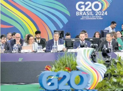  ?? AP ?? Brazilian Finance Minister Fernando Haddad, centre, speaks during the G20 Finance Ministers and Central Bank Governors meeting in Sao Paulo, Brazil, on February 29, 2024. Haddad has struggled to meet his ambitious fiscal targets.