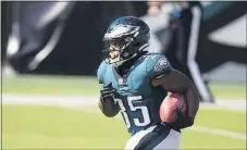  ?? CHRIS SZAGOLA - THE ASSOCIATED PRESS ?? With Miles Sanders and Zach Ertz out, it will be up to reserves like running back Boston Scott to fill the voidwhen the Eagles host the New York Giants Thursday night.