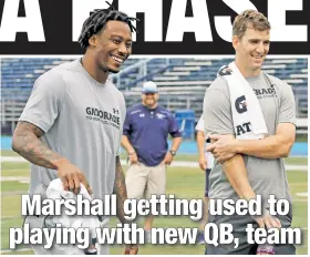  ?? N.Y. Post: Charles Wenzelberg ?? GROWING TOGETHER: Brandon Marshall (left) and Eli Manning speak to kids in Wayne, N.J. during the AIRO 7v7 New Jersey North Football Event on behalf of Gatorade.
