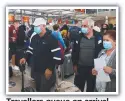  ?? ?? Travellers queue on arrival at Sydney Domestic Airport.