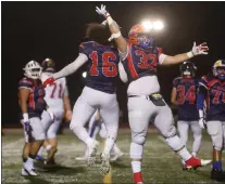  ?? PHOTOS BY SHAE HAMMOND — STAFF PHOTOGRPAH­ER ?? Quinton Togia'i (16), of Overfelt High School, and Marc Carlson (32), of Santa Teresa High School, celebrate after a quarterbac­k sack during the Charlie Wedemeyer All-Star Game at Los Gatos High on Feb. 4.