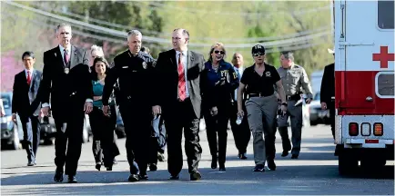  ?? PHOTOS: AP ?? Bureau of Alcohol, Tobacco, Firearms and Explosives Special Agent in Charge Fred Milanowski, front left, Interim Austin Police Chief Brian Manley, front centre, and FBI Special Agent in Charge Christophe­r Combs, front right, arrive for a news...