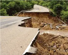  ?? Associated Press file photo ?? The Biden administra­tion grants will fund 80 projects to shore up the nation’s infrastruc­ture against the harmful impacts of climate change, such as this flood damage to Texas 6 in Cisco in 2016.