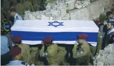  ?? (Yonatan Sindel/Flash90) ?? SOLDIERS CARRY the coffin of soldier Ronen Lubarsky at Mount Herzl Military Cemetery in Jerusalem in 2018. Lubarsky died from wounds sustained in a West Bank military operation.