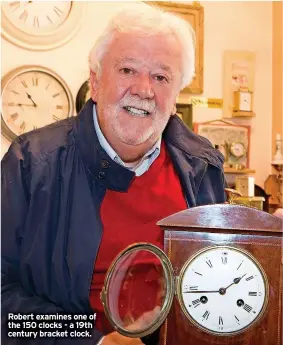 ?? ?? Robert examines one of the 150 clocks - a 19th century bracket clock.